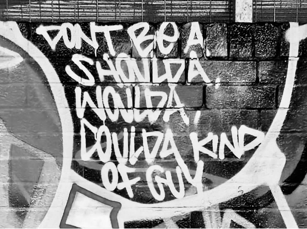 Street art reading: Don't be a shoulda woulda coulda kinda guy