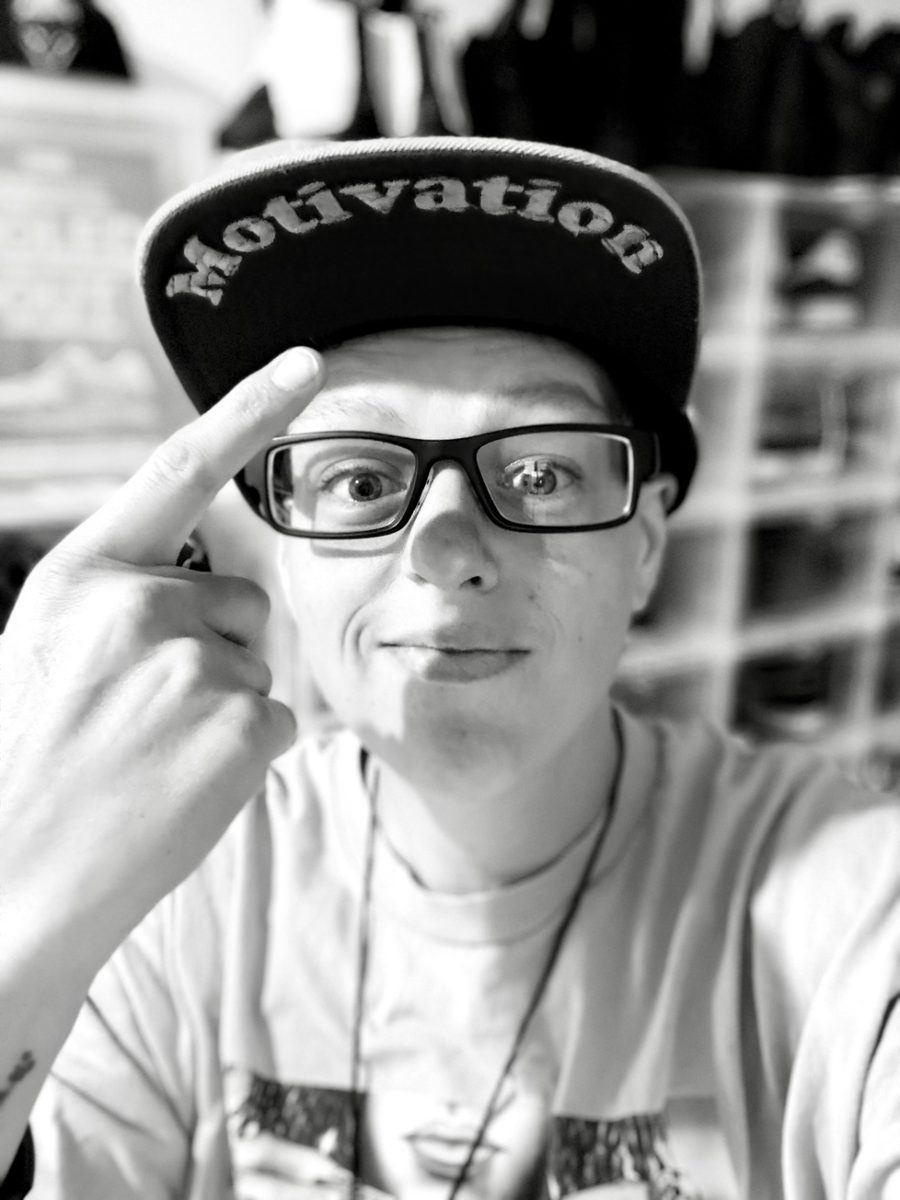 Pointing to a cap that reads 'Motivation'